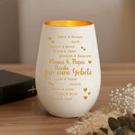 Windlicht auf einem Tisch neben einer Bibel